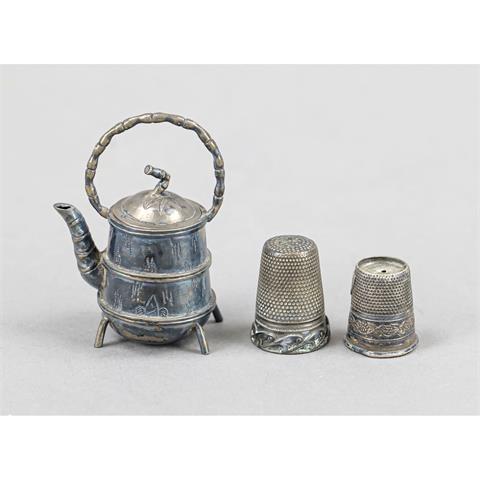 A miniature cauldron and 2 thim